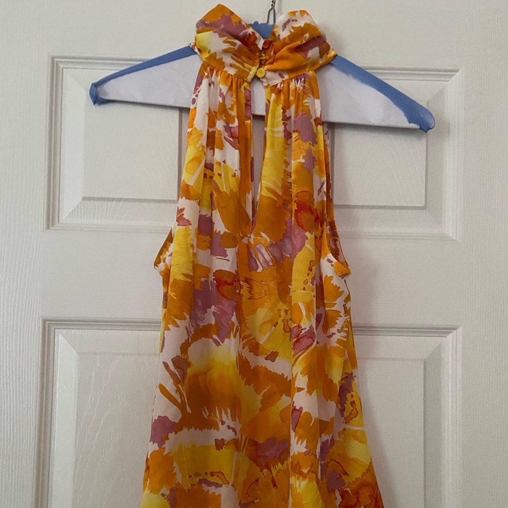Top-sleeveless high button neckline. SZ M. Flowy fit & gorgeous colors. NWT